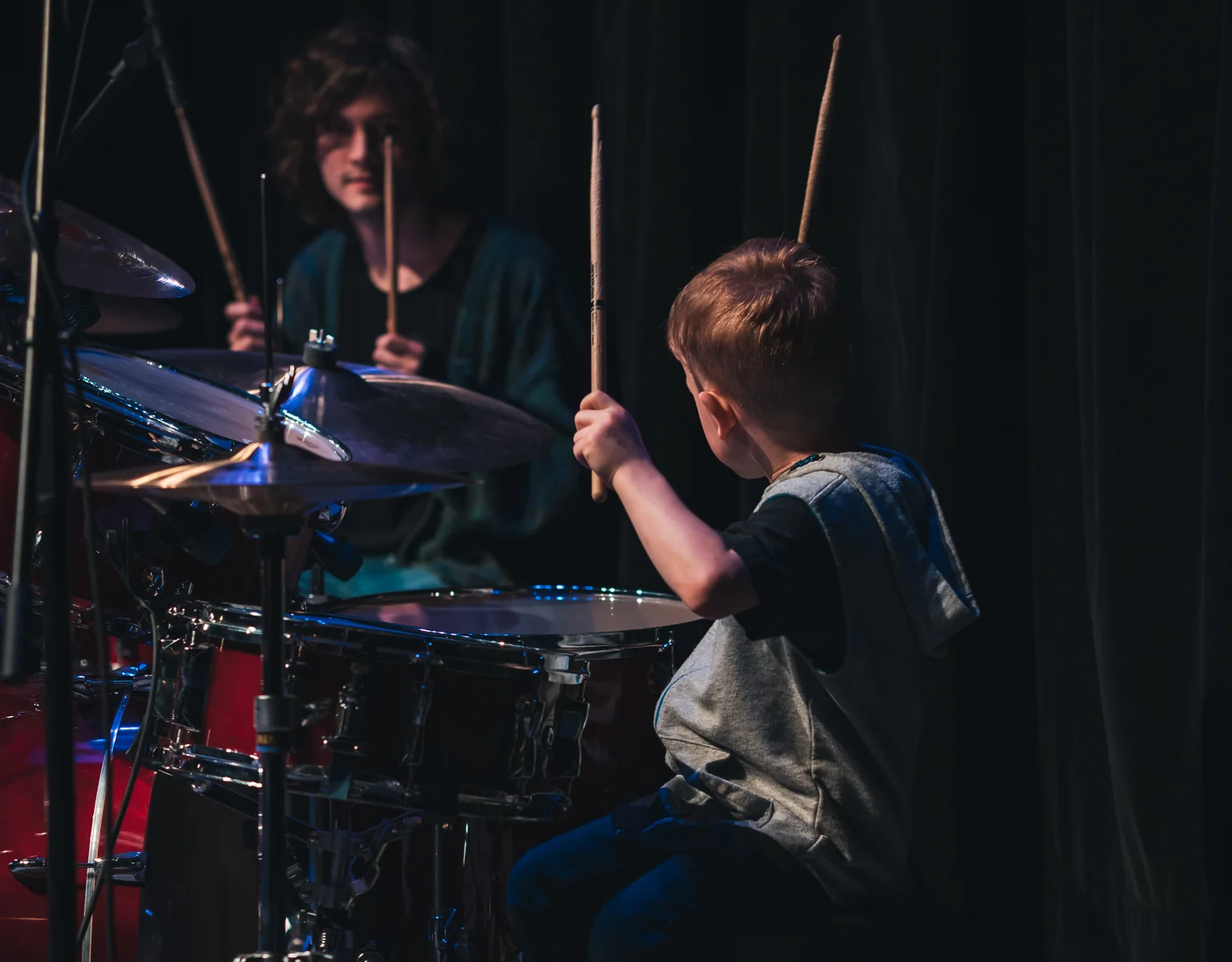 Young drummer performing at a recital with another drummer at Resonate in Edmonton