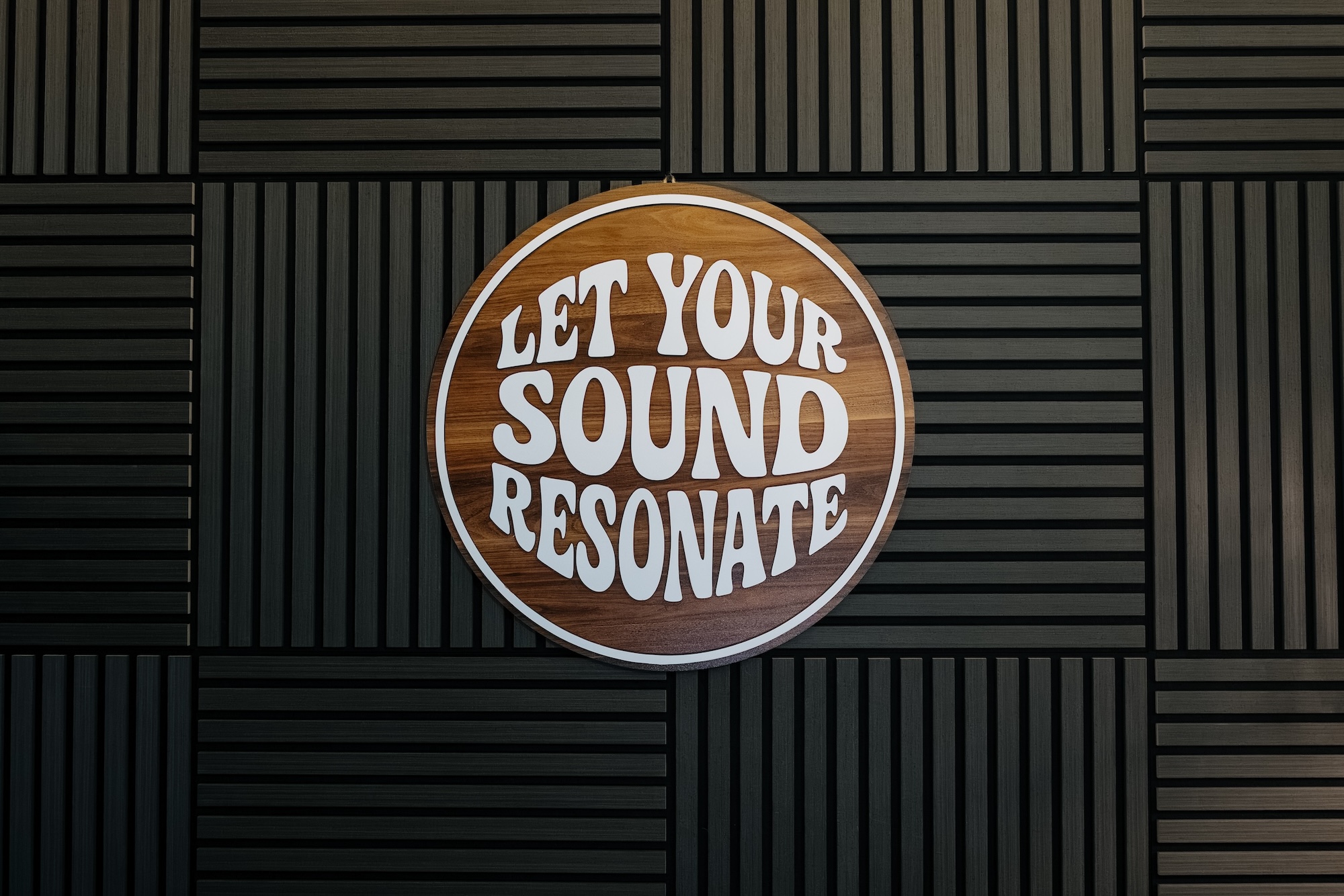 Let your sound resonate sign on Resonate acoustic wall