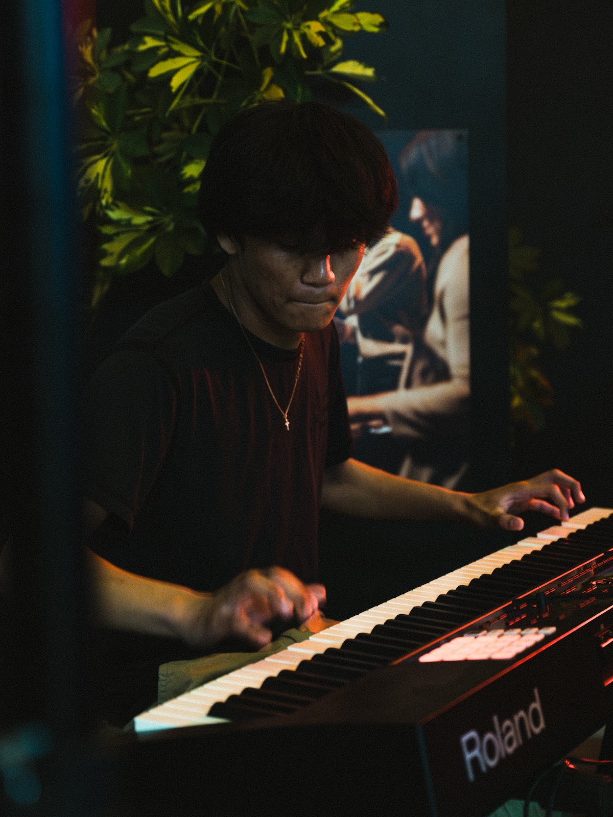 Mature player seated at the keyboard during a piano lesson at Resonate